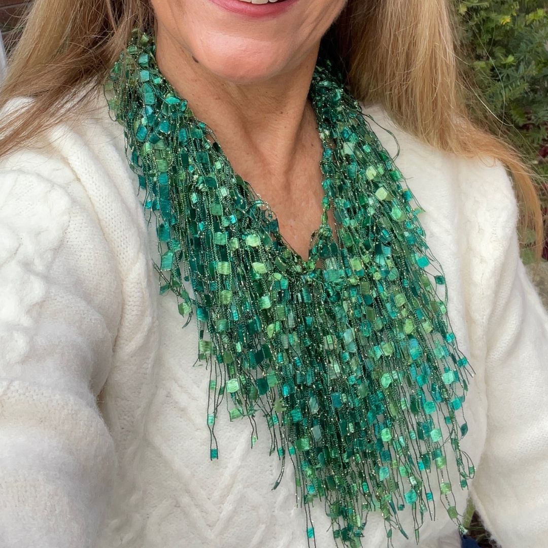 Green Scarf necklace for women shown on lady wearing a cream color top